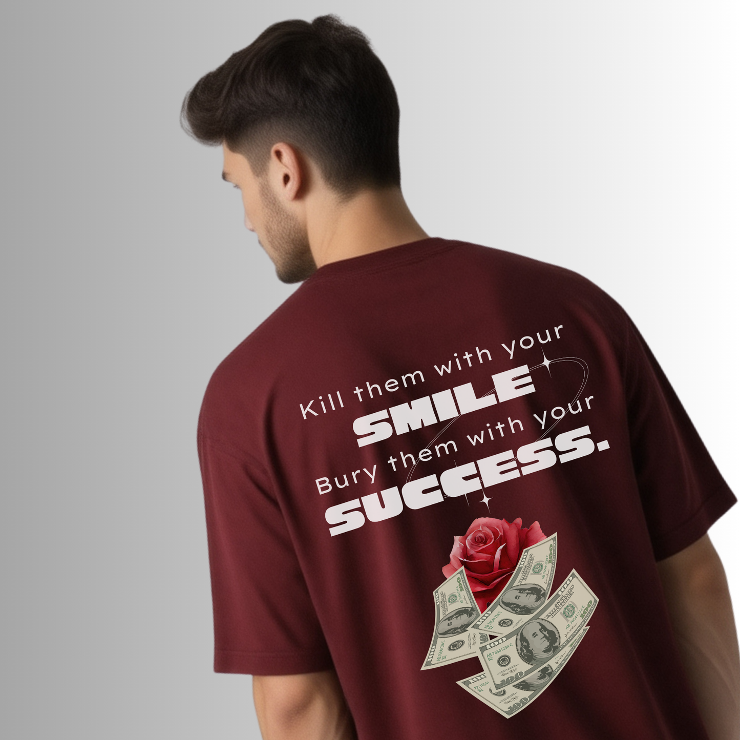 Man wearing a maroon t-shirt with motivational text and a rose design on the back.